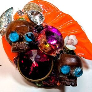 Wendy Gell Halloween pin two wood skulls orange leaves and Swarovski Stones.